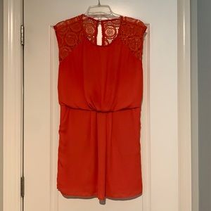 Women’s Medium Orange Dress. Lace detail on shoulders and back. Short length.